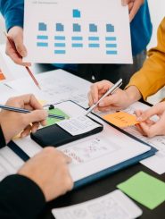 close-up-view-of-ui-developer-team-brainstorming-o-EUGEWSU